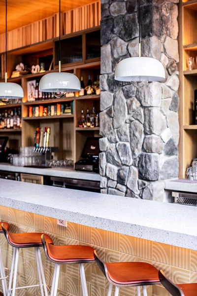 Cultured Stone Echo Ridge Dressed Fieldstone gray thin stone on interior wall column with full bar