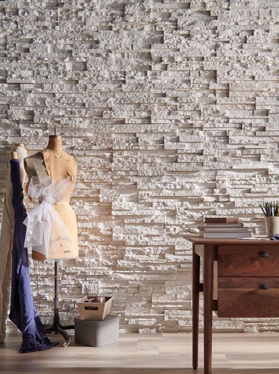 Cultured Stone Pro Fit Alpine Ledgestone Winterhaven warm white thin stone on interior wall with desk in front