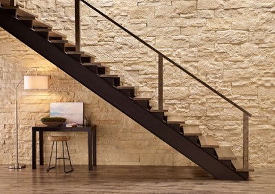 Eldorado Stone Cut Coarse Oyster warm white thin stone on interior wall with stairs