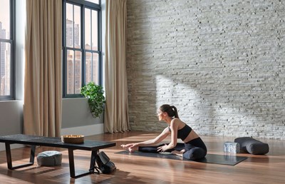 Eldorado Stone European Ledge Sea Cliff gray thin stone on interior home gym wall