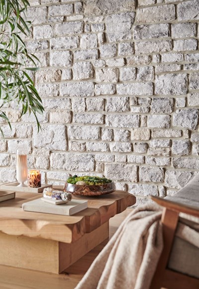 Eldorado Stone Limestone Grand Banks creme and gray thin stone on interior wall
