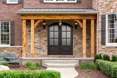 Glen-Gery | Glen Ridge Sonoma brown and tan building veneer stone on home exterior front entry with double door and red brick