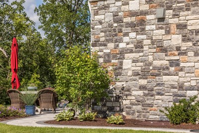 Glen-Gery | Limestone Chisel Grey building stone veneer on exterior of home
